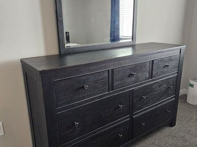 Moving my loss your gain!
Millennium by Ashley 7-Drawer Dresser with Beveled Mirror, Matching End Table - Black Distressed Wood