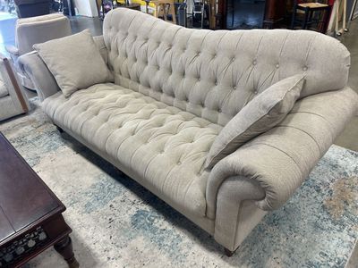 vintage high-back curved Chesterfield conversation sofa.