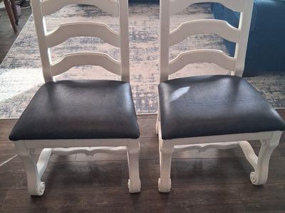 Two, white solid wood chairs