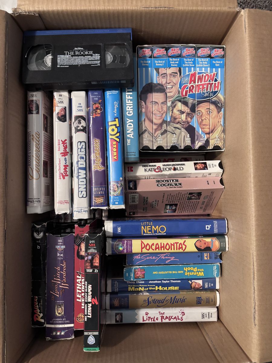 A Box of various movies in DVD and VHS