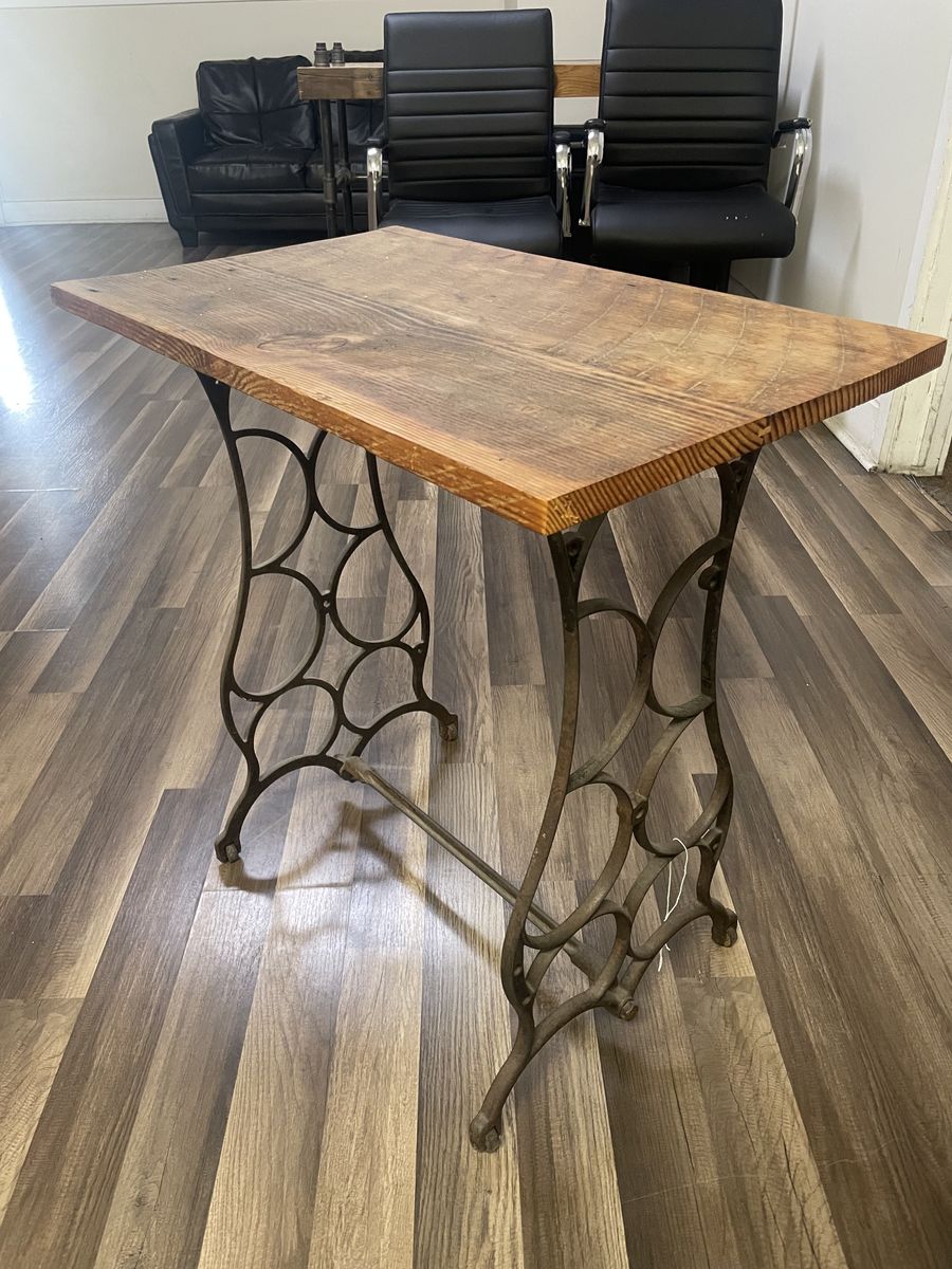 Small table with old sewing machine legs