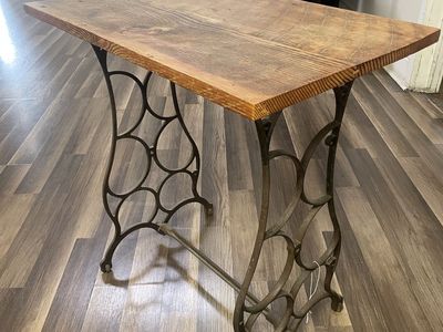 Small table with old sewing machine legs