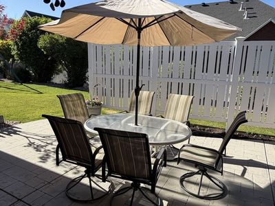 Patio Table, Chairs, Umbrella and stand.