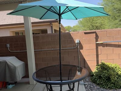 Outdoor glass table with umbrella
