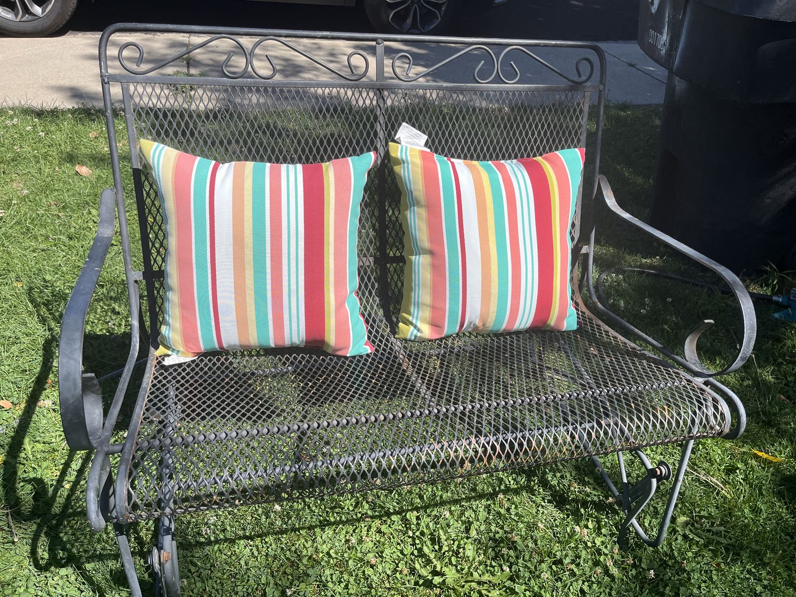 Wrought iron patio glider bench