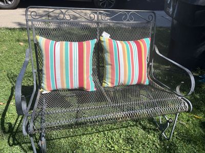 Wrought iron patio glider bench