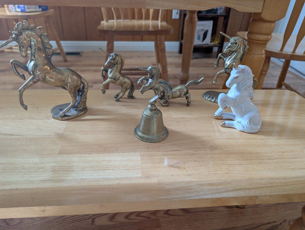 Brass unicorn figurines and vases