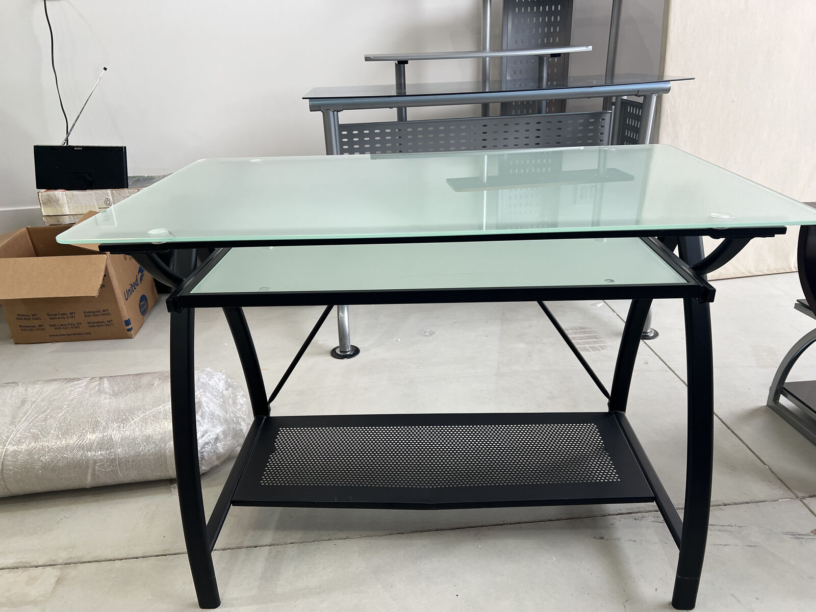 Black metal and glass desk with pull out keyboard shelf