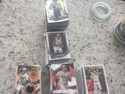Baseball football and basketball cards