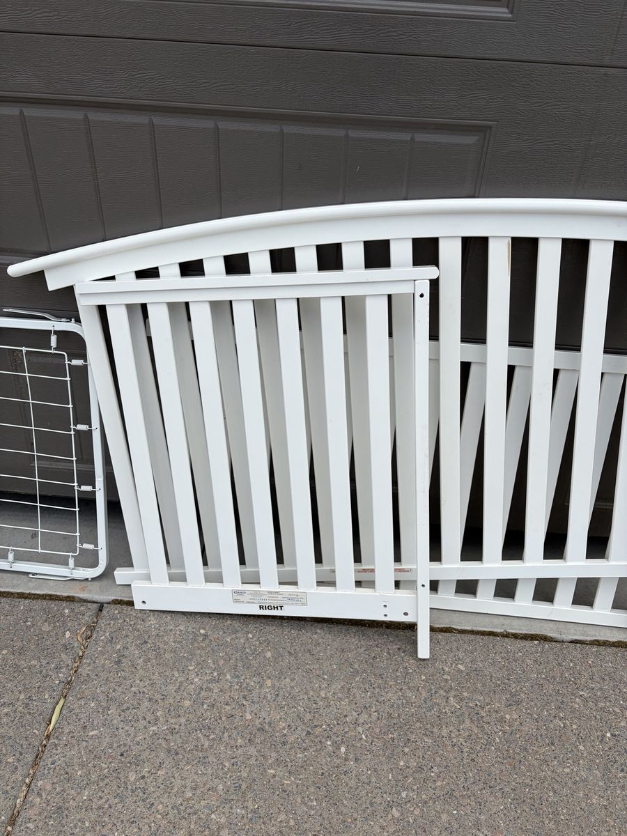White wooden crib with mattress