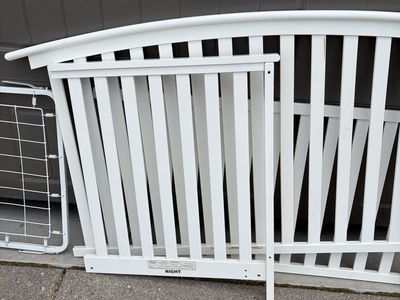 White wooden crib with mattress