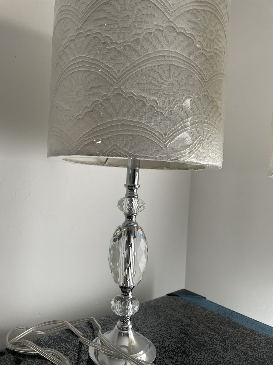 Pretty crystal lamps with white lace lamp shades. Barely used. Like new. Plastic still on shades.