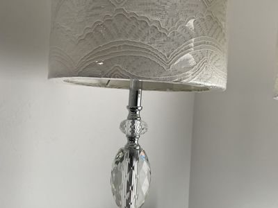 Pretty crystal lamps with white lace lamp shades. Barely used. Like new. Plastic still on shades.