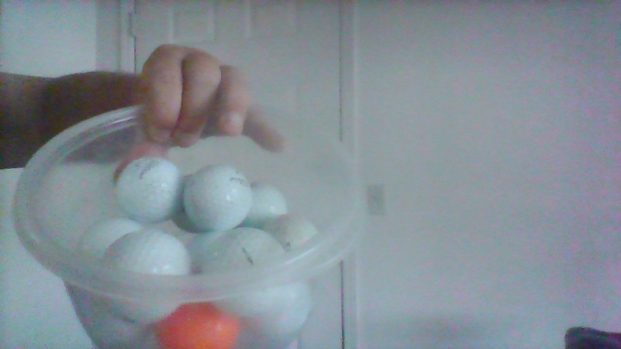 Lots of used golf balls