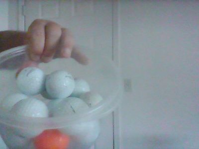 Lots of used golf balls
