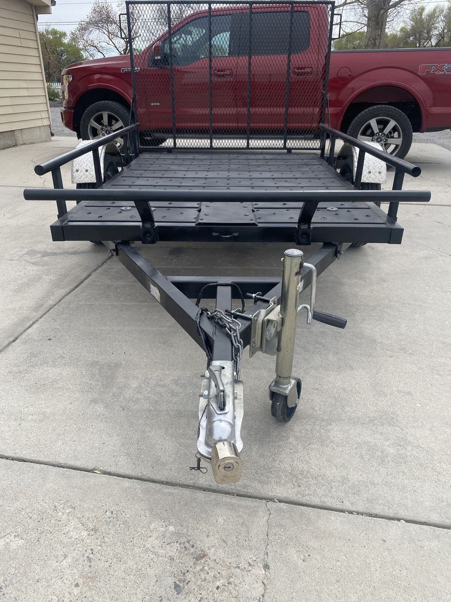 Heavy duty ALL METAL Utility trailer w/ steel ramp. LED lights.