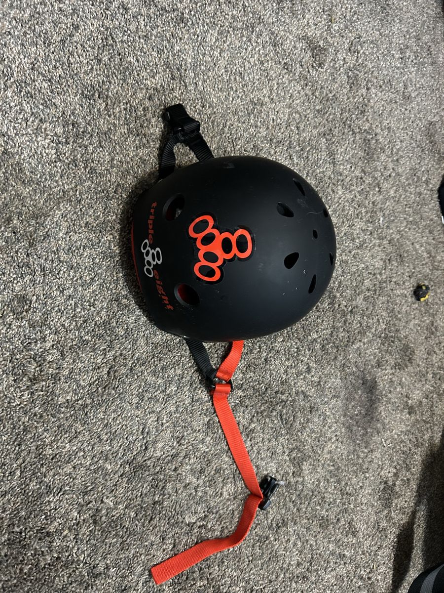 Triple Eight Skate Helmet Matte Black with Red Inner Lining and spitfire sticker