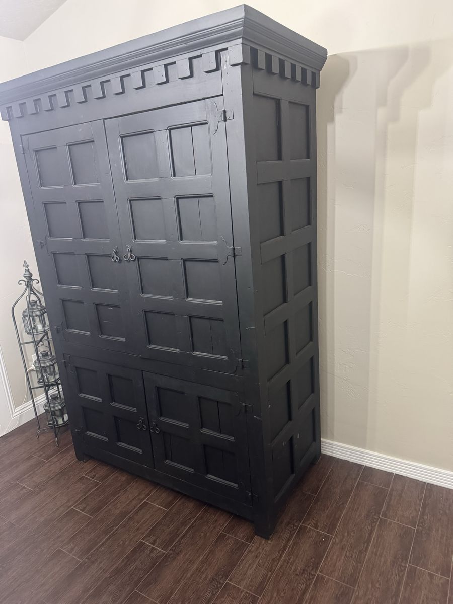 Large Black Wooden Armoire Cabinet with Panel Details and Storage