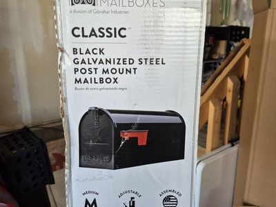 black mailbox and metal post