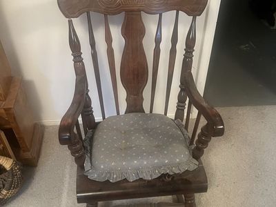 Vintage Wooden Rocking Chair with Carved Back and Seat Cushion
