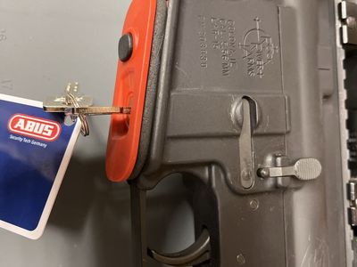 AR 15 firearm lock. Abus Security-Tech Germany FTS Gun Lock - Red, w/ Keys & Code Card.