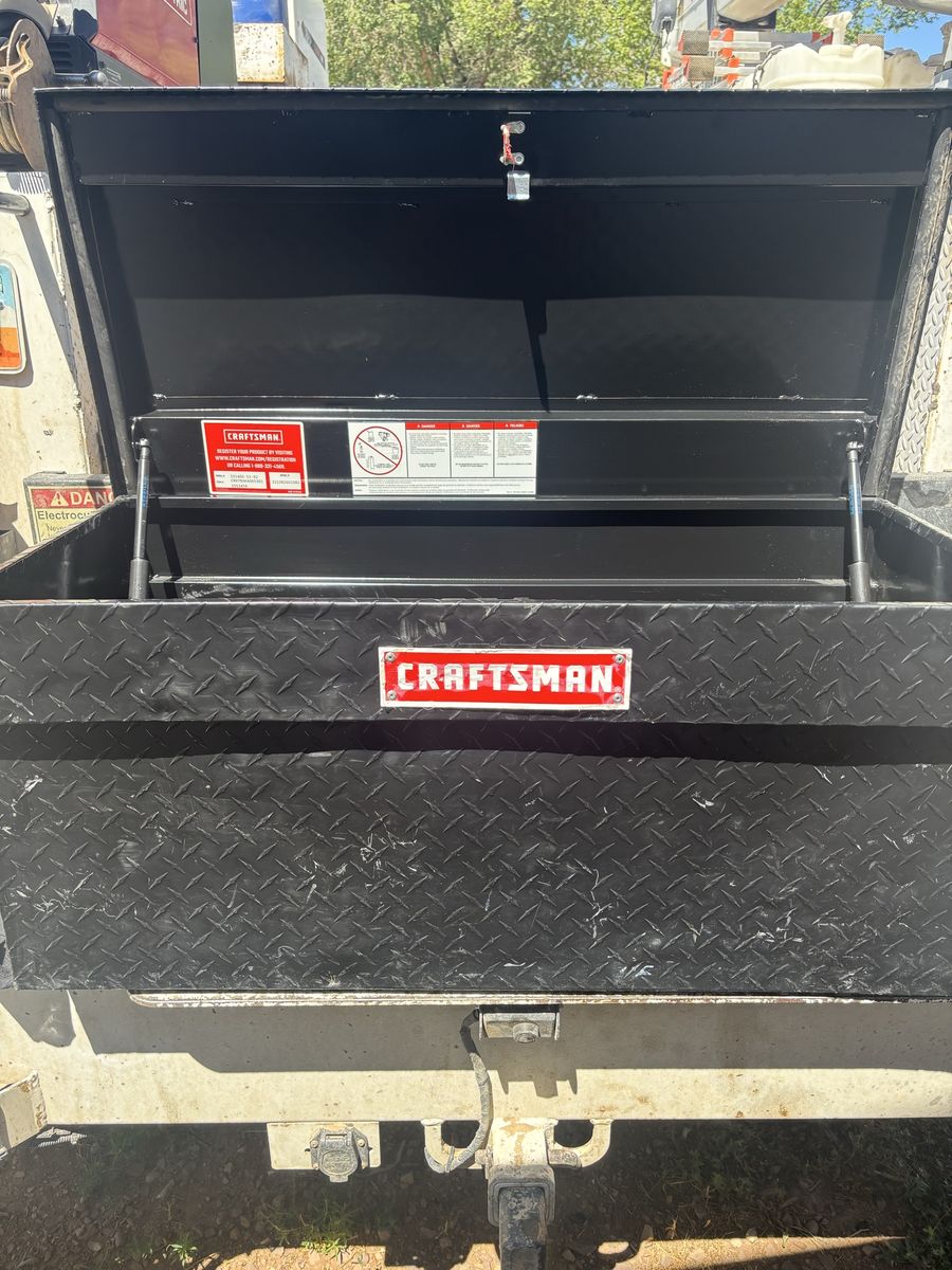Black craftsman in bed tool box