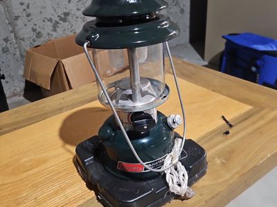 Vintage Coleman dual-mantle lantern Model 2884700 with red plastic carrying case