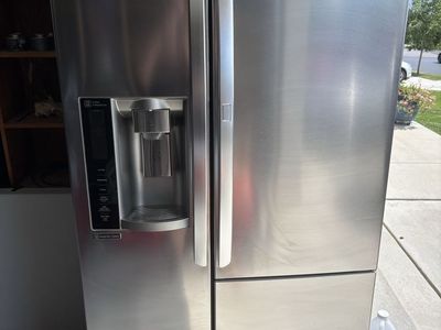 LG Stainless Steel Side-by-Side Refrigerator with Water Dispenser