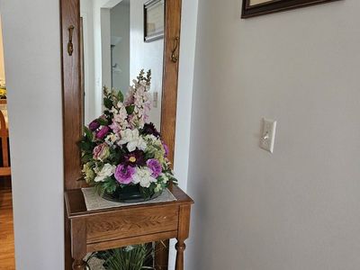 Entry mirror/coat hanger.