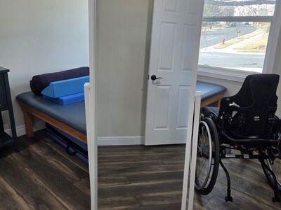 Mirror on stand with wheels