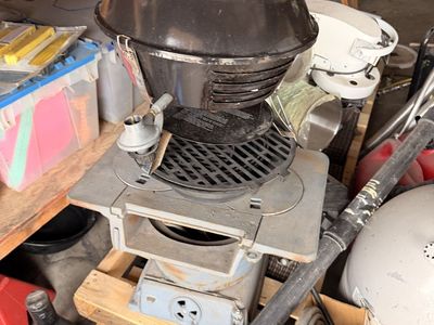 Small cast-iron stove, & hibachi grill & small picnic table barbecue propane grill.
