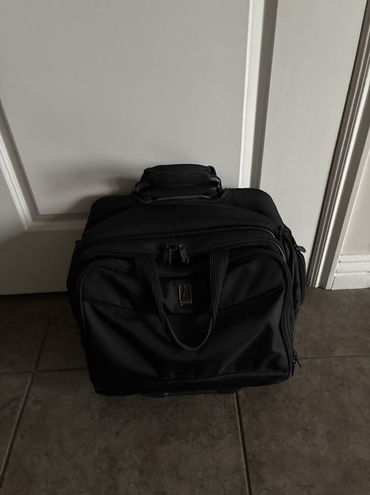 TravelPro Rolling briefcase / carry on bag on wheels.