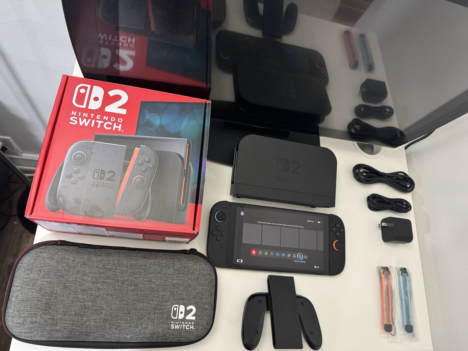 Nintendo Switch 2 / Dock / Joy Cons / Grip /Power Cable / Hdmi Cable / Carrying Case / Box