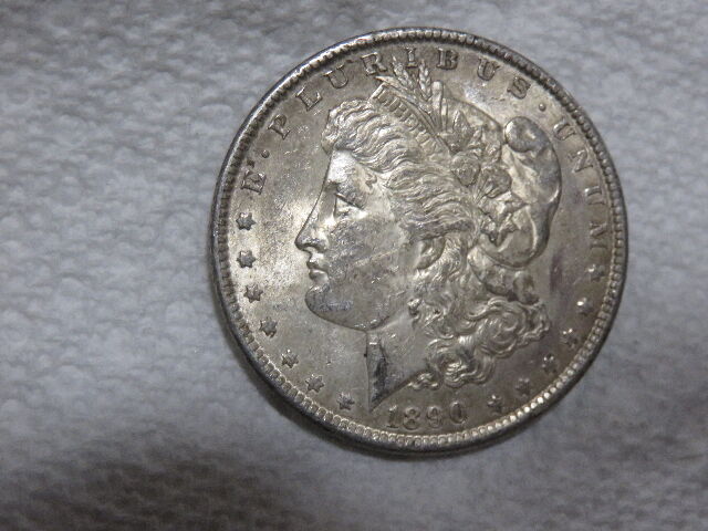 A COUPLE OF 135+ YEAR OLD MORGAN SILVER DOLLARS