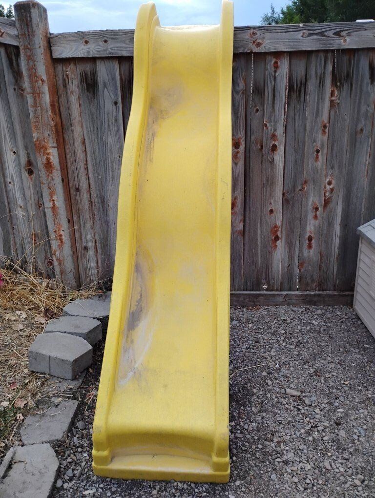 Curvy Yellow Plastic Wave Slide Playground Fun