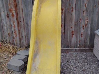 Curvy Yellow Plastic Wave Slide Playground Fun