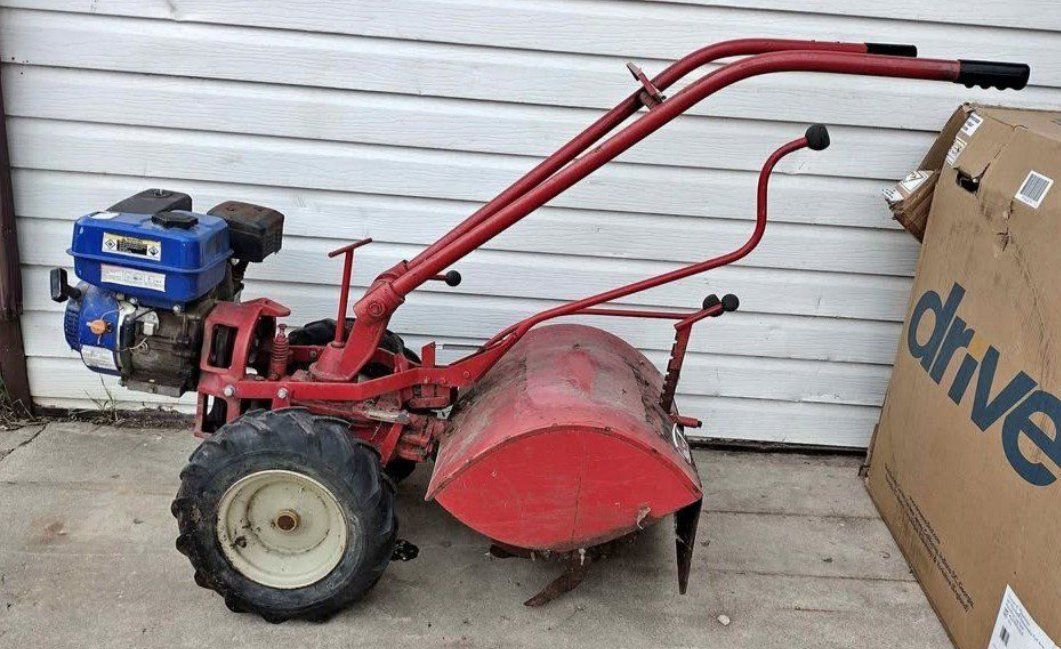 Troy Bilt Tiller with a 5HP  engine. Runs, but  ne