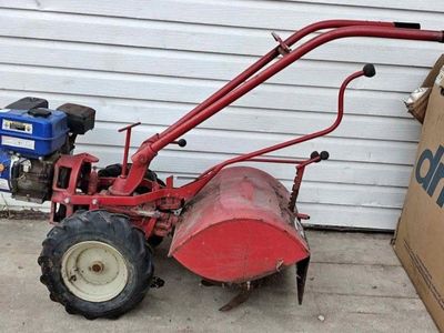 Troy Bilt Tiller with a 5HP engine. Runs, but ne