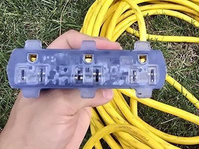 Power Zone Heavy Duty Yellow Outdoor Extension Cord with 3-Outlet Lighted Splitter End