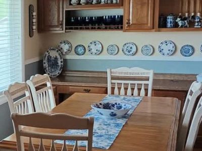 Dining Room Table and 6 Chairs included 1 leaf- Light Wood Top, Cream Legs & Frames, Blue/White Fabric chair pads.