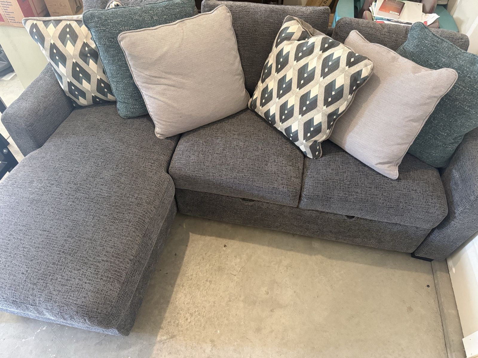 Modern Gray Sectional Sofa with Pull-Out Bed and Accent Pillows