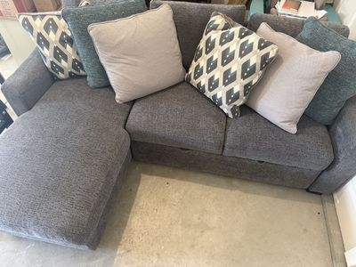 Modern Gray Sectional Sofa with Pull-Out Bed and Accent Pillows