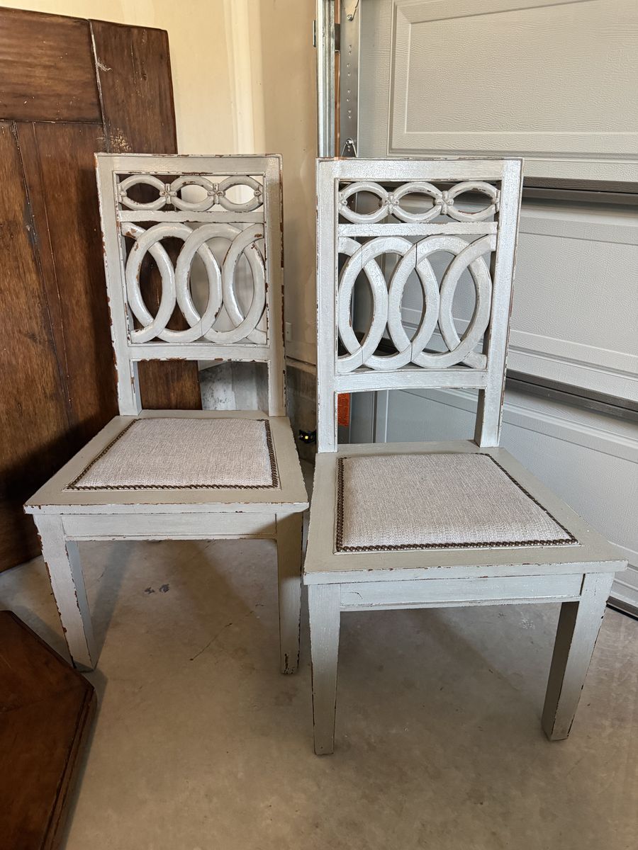 Set of 2 wood dining chairs. Durable textile Seat with bronze nailheads. These make a statement!