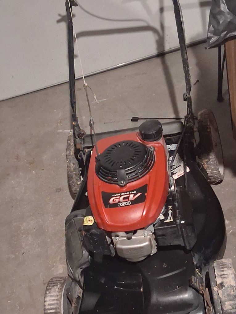 two self propelled Honda lawnmowers