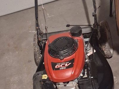 two self propelled Honda lawnmowers