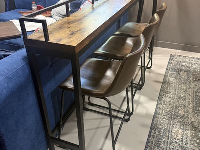 Sofa table with bar stools