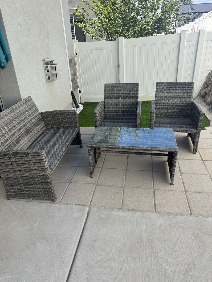 Durable Grey Wicker 4-Piece Patio Set: Loveseat, 2 Armchairs, Coffee Table with Tempered Glass