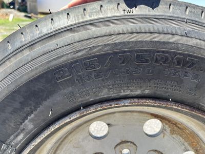 New trailer tire on used rim