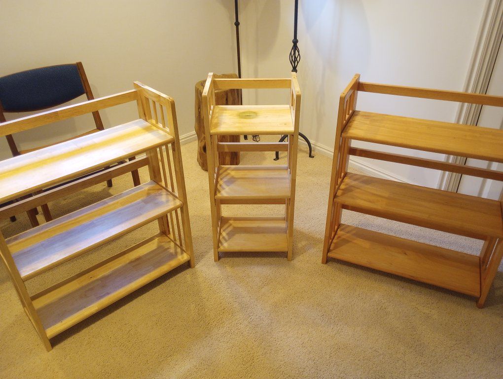 Three matching hardwood folding shelves.