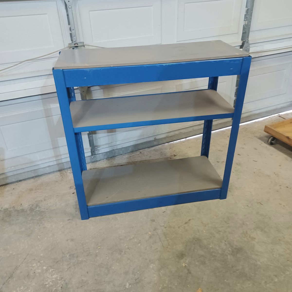 Metal and wood shelf.